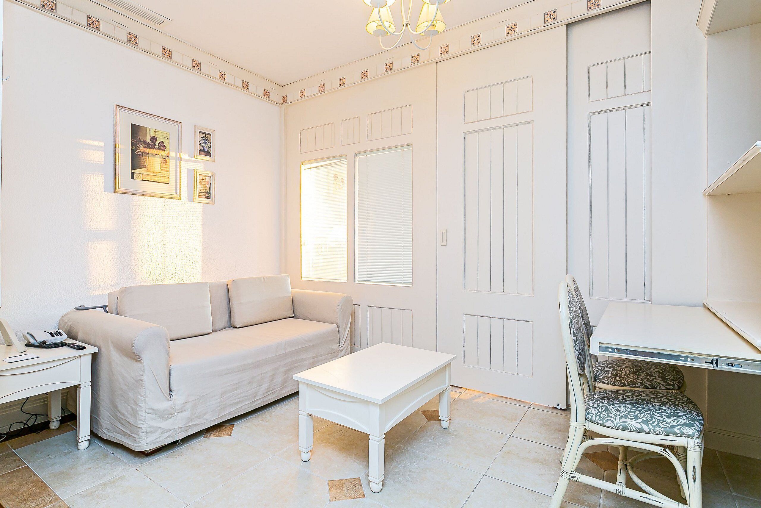Deluxe Studio, Pool View | Living area | LED TV