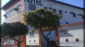 A building with a sign that reads "HOTEL" and "HOTEL SUITES."