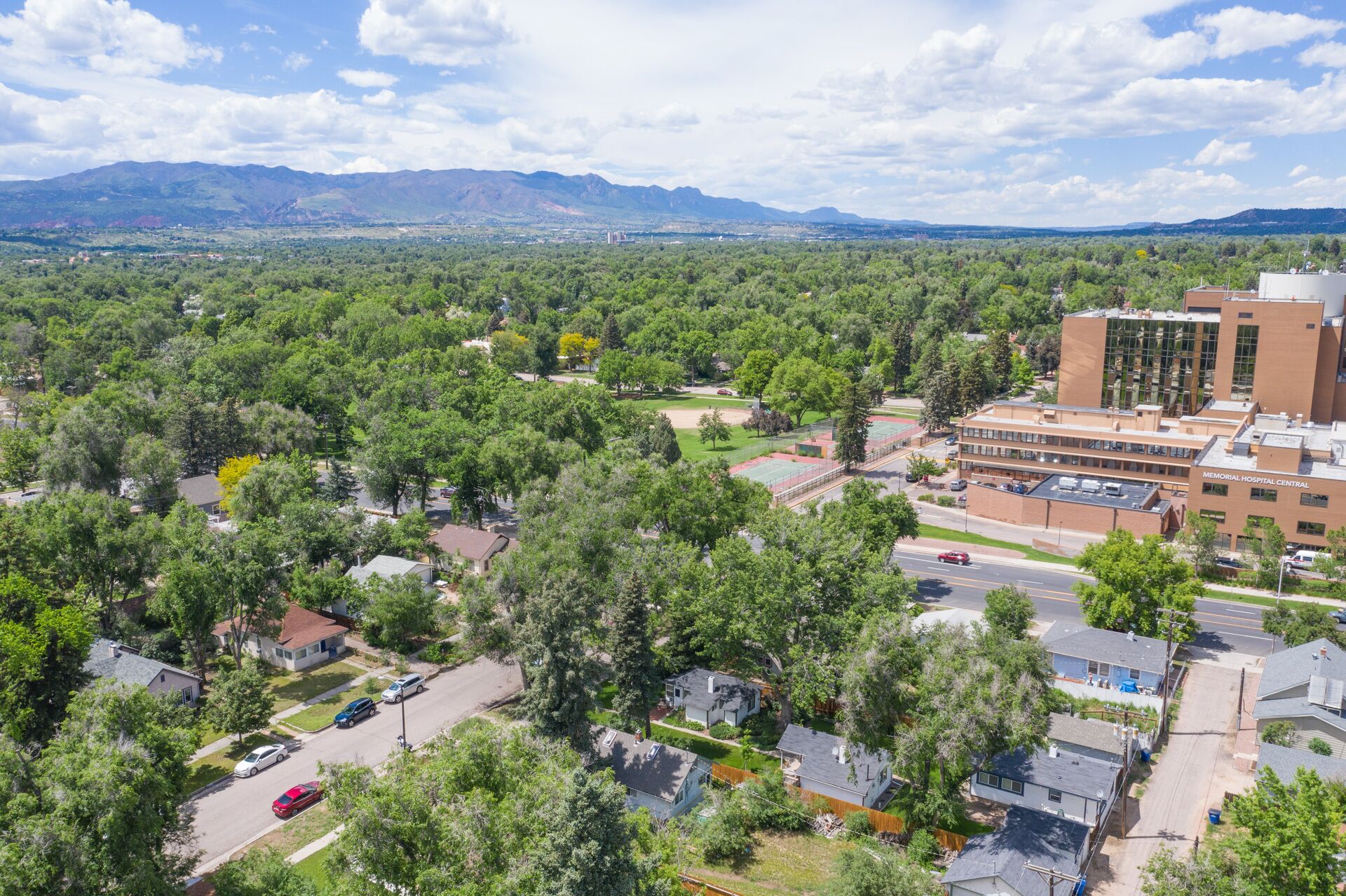 A residential area with houses, a road, and a large building labeled "Memorial Hospital Central".