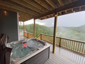 A hot tub on a wooden deck with a view of a forested landscape. - Breathtaking 6Bd/6 Bath/PRIVATE DOCK All The Bells and Whistles! (La Follette)