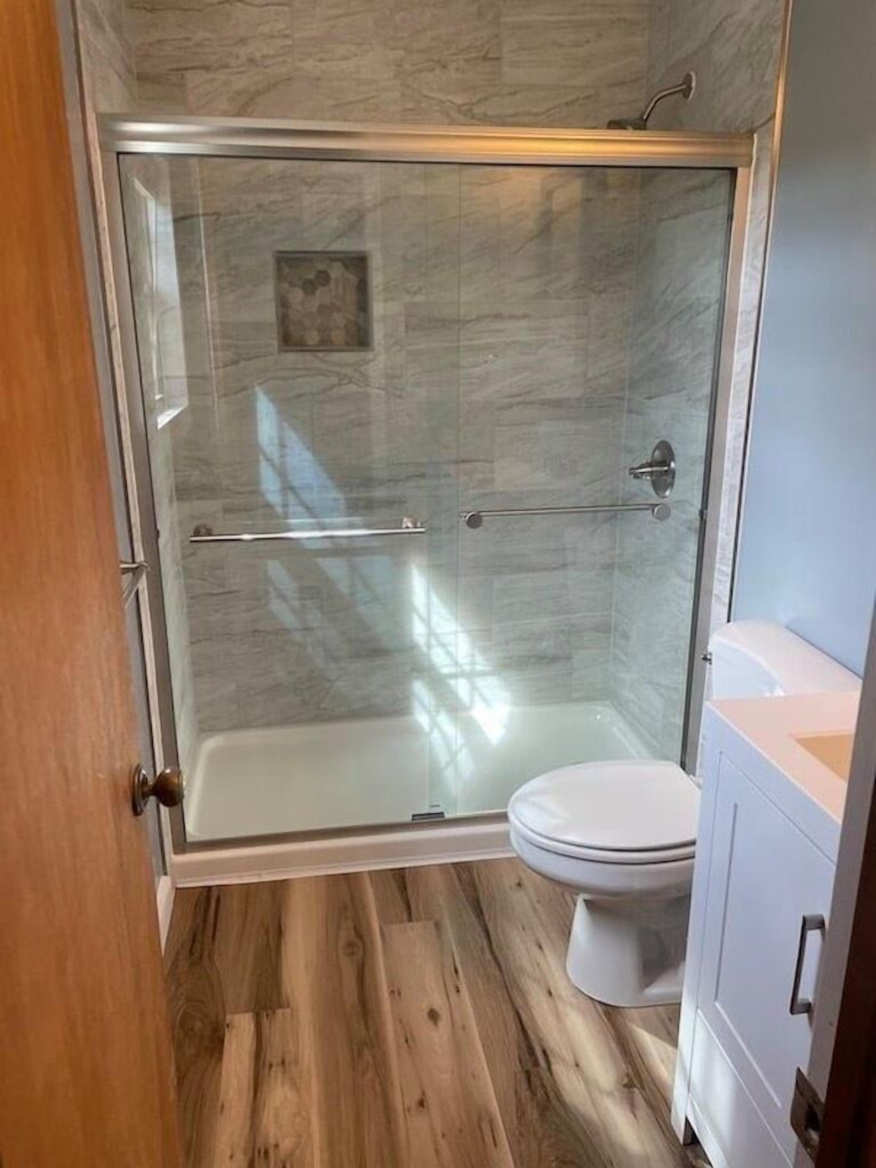 Combined shower/tub, hair dryer, towels, soap