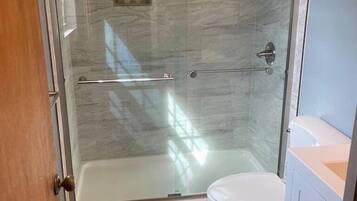Combined shower/tub, hair dryer, towels, soap