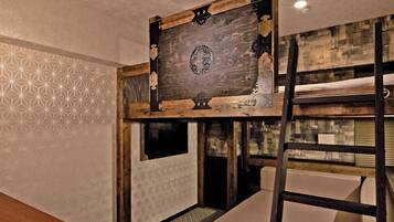 A bunk bed with a wooden headboard, a ladder, and a window.