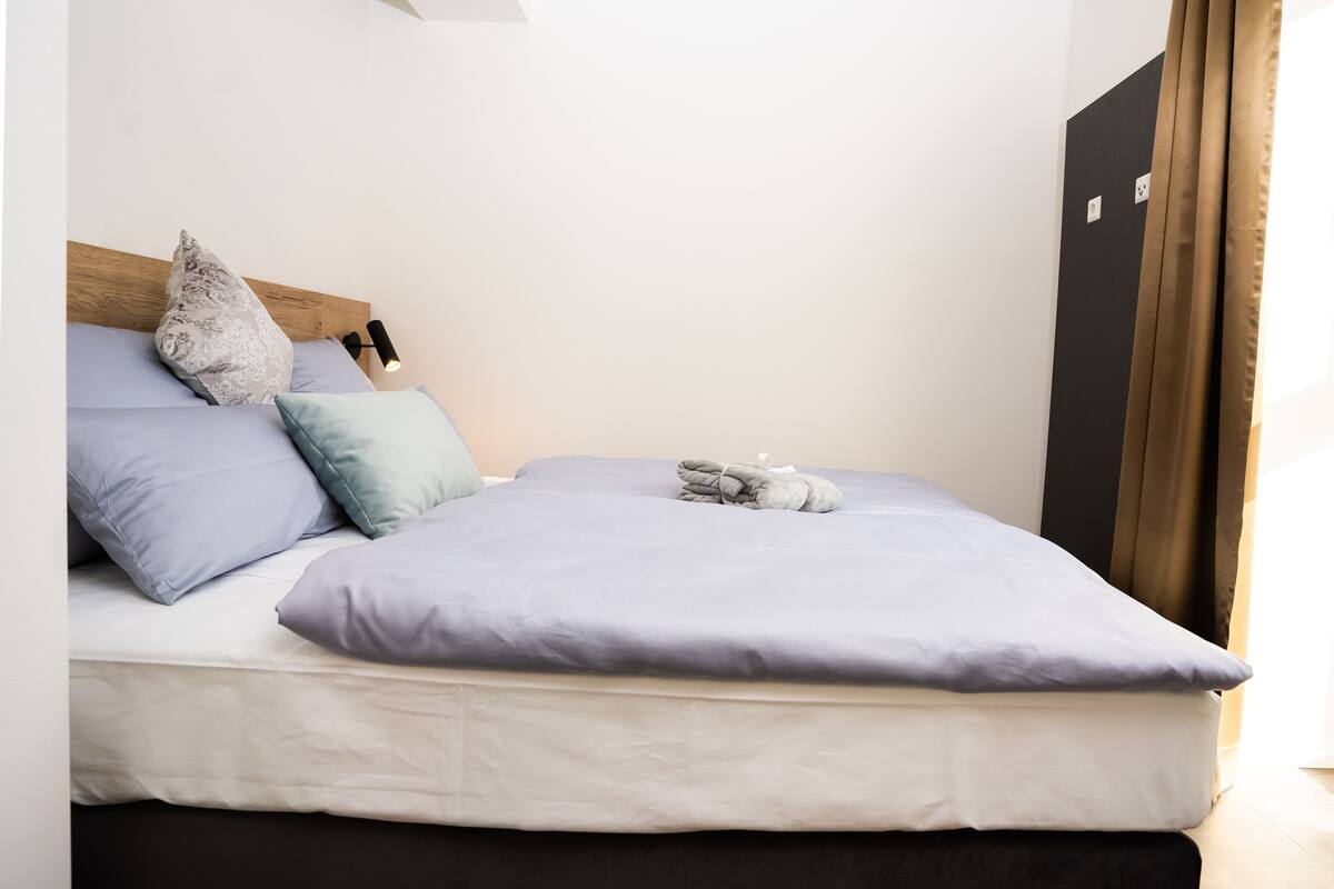Deluxe Double Room, Kitchen | Desk, laptop workspace, blackout curtains, free WiFi