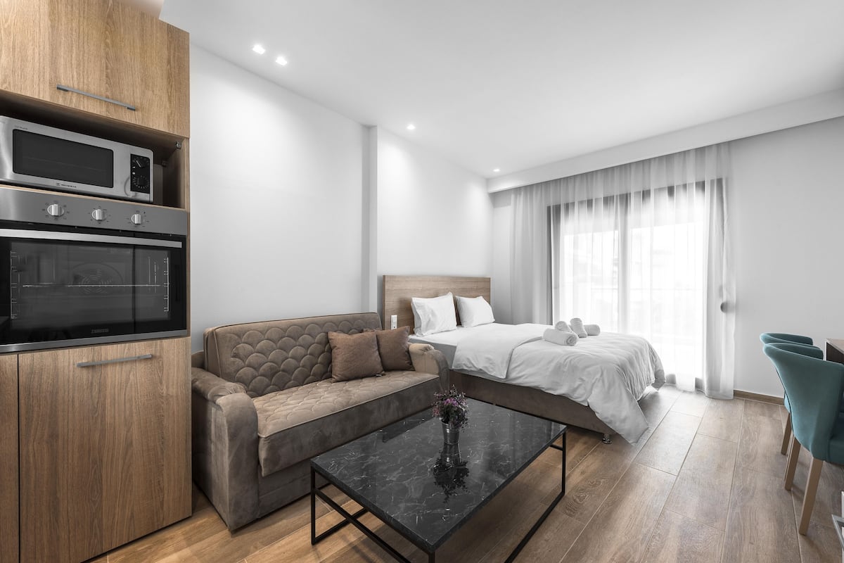 Studio, Balcony, City View | Living area | Flat-screen TV
