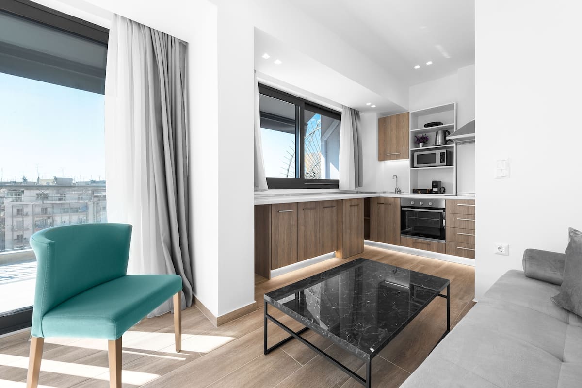 Panoramic Penthouse, 1 Bedroom, Balcony, City View | Living area | Flat-screen TV
