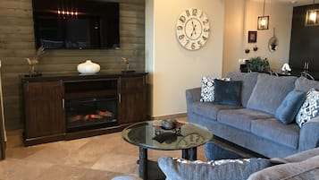 Flat-screen TV, fireplace, DVD player, video library