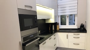 Apartamento exclusivo | Cozinha privada | Cafeteira/chaleira, geladeira, micro-ondas, fogão