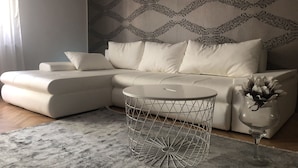 Apartamento exclusivo | Área de estar | TV de tela plana, pisos aquecidos
