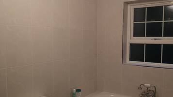 Family House | Bathroom | Free toiletries, hair dryer, towels