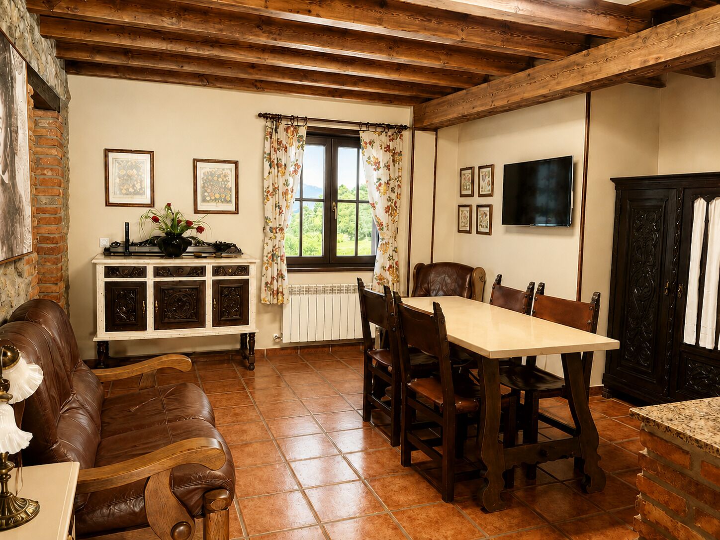 A dining area with a wooden table and chairs, a fireplace, and a window with curtains.