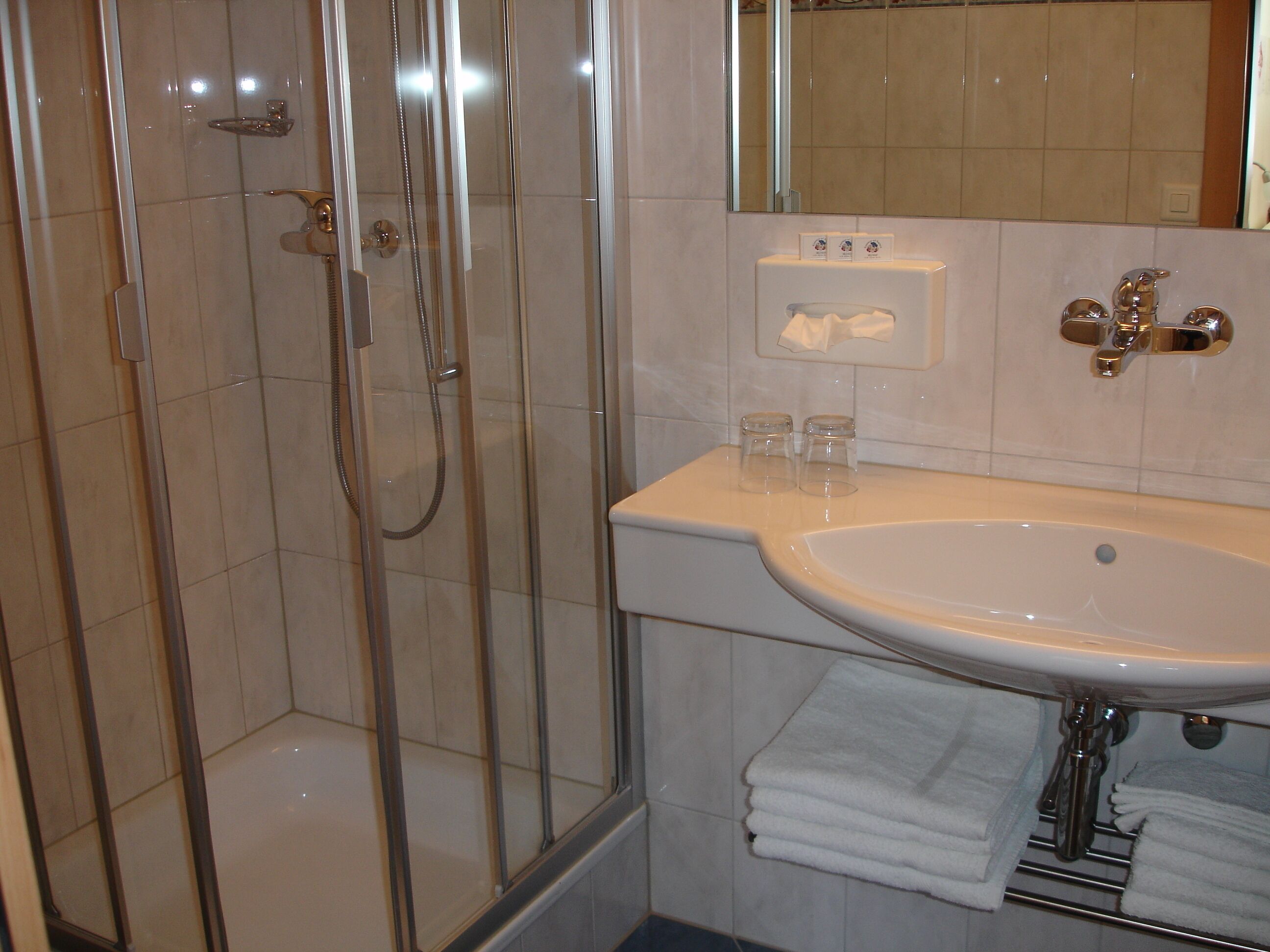 hair dryer, slippers, towels, soap