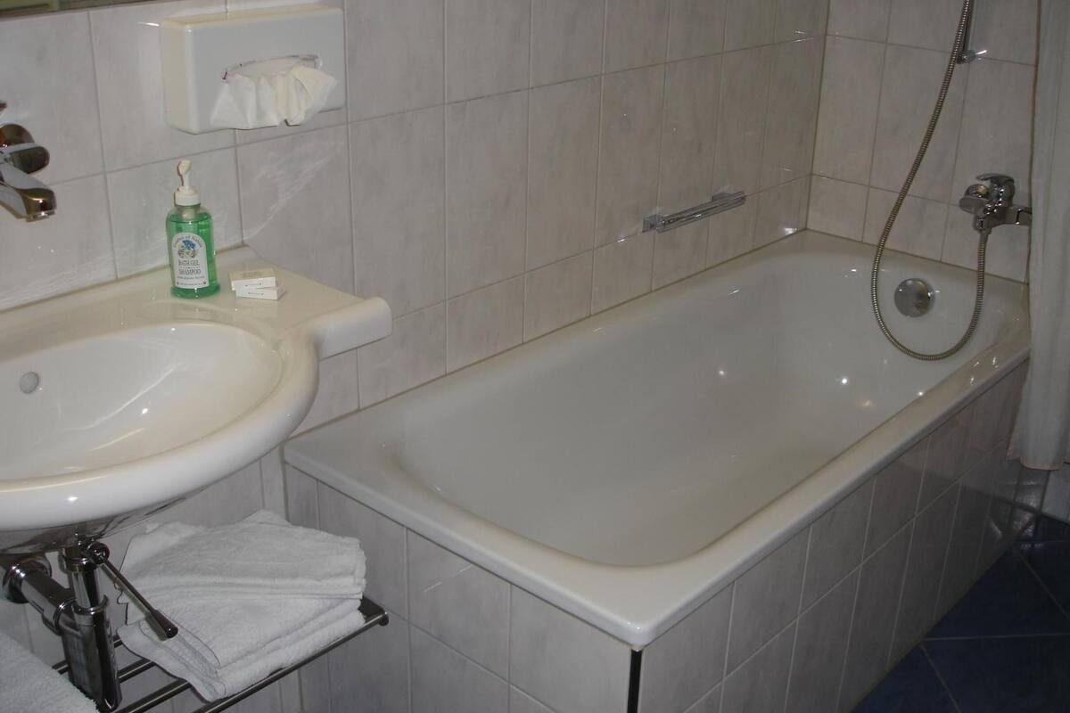 hair dryer, slippers, towels, soap