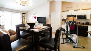 A modern apartment with a dining area, kitchen, and living space. - 1 Clean & Cozy Private Bedroom with 1 Private Full Bath (Edmonton)