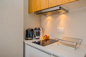 Fridge, microwave, stovetop, coffee/tea maker