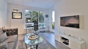 Living room - Unique Urban Flat 1BR w/ Pool+parking+wifi & More! (San Jose)