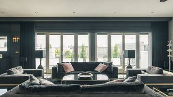 Premium Apartment, 3 Bedrooms | Living room | Flat-screen TV