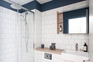 Combined shower/tub, hair dryer, towels, soap