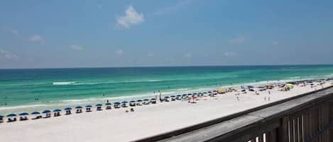 On the beach, sun loungers, beach towels