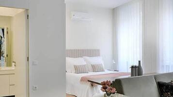 City Studio Suite (2F) | Living area | 40-inch flat-screen TV with cable channels, Smart TV