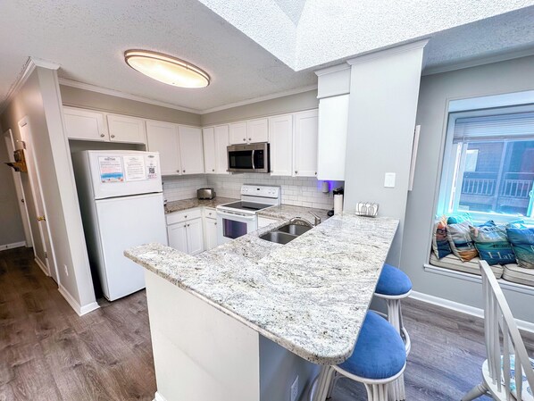Fridge, microwave, oven, stovetop - Experience Tilghman Beach and Racquet Club Unit 320! 3 Bedroom Ocean View Condo. Pools, Tennis, Close to Main Street! (North Myrtle Beach)