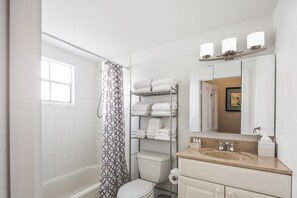 Bathtub, hair dryer, towels