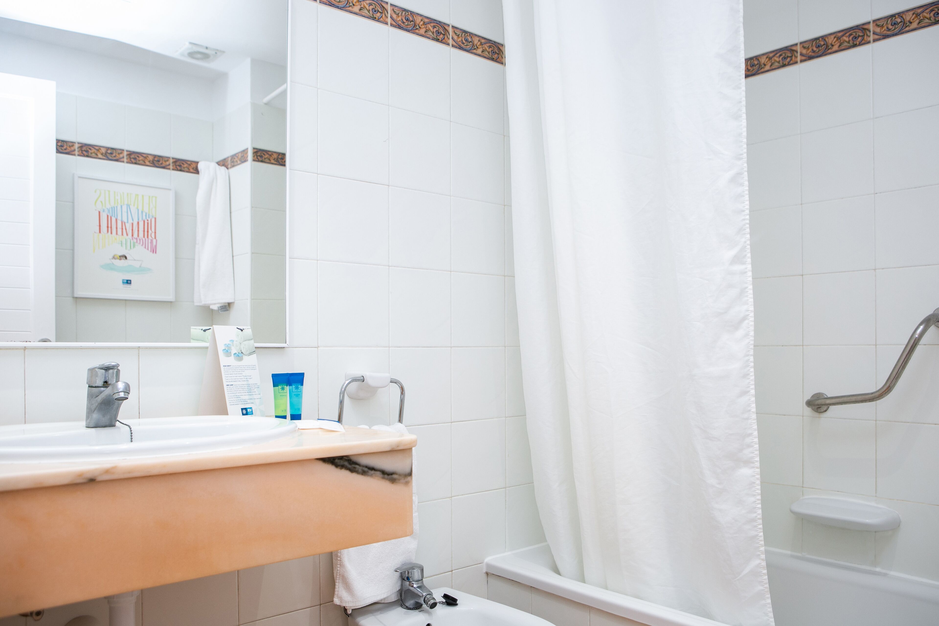 hair dryer, bidet, towels, soap