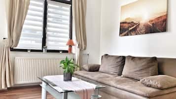 Apartment, 1 Bedroom, Lake View | Living room | 30-inch flat-screen TV with satellite channels, TV
