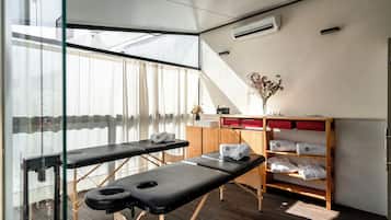 Relax in a serene space with two massage tables and a calming atmosphere.