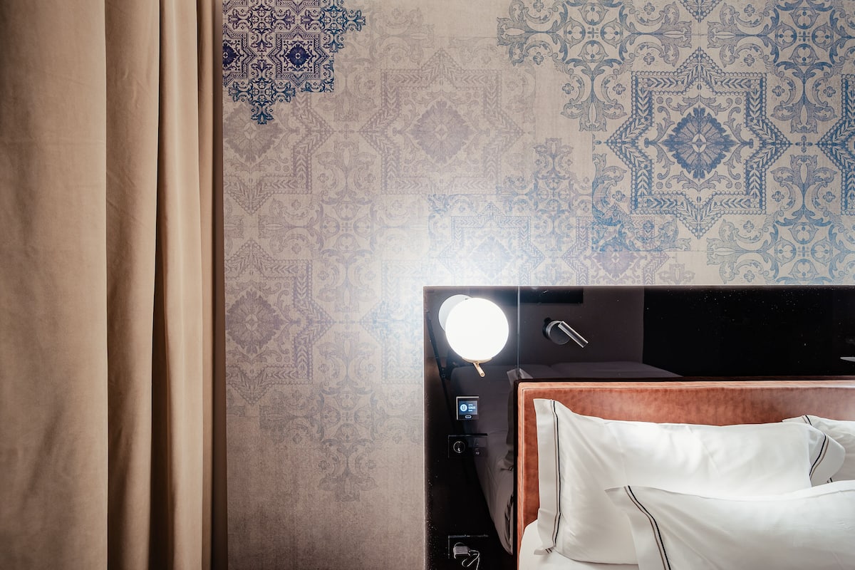 Premium bedding, down comforters, memory foam beds, minibar