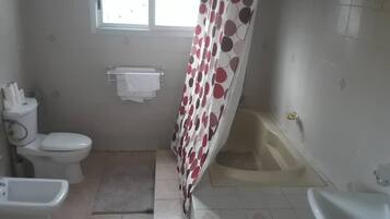 Deluxe Room, 1 King Bed | Bathroom | Shower, rainfall showerhead, free toiletries, hair dryer
