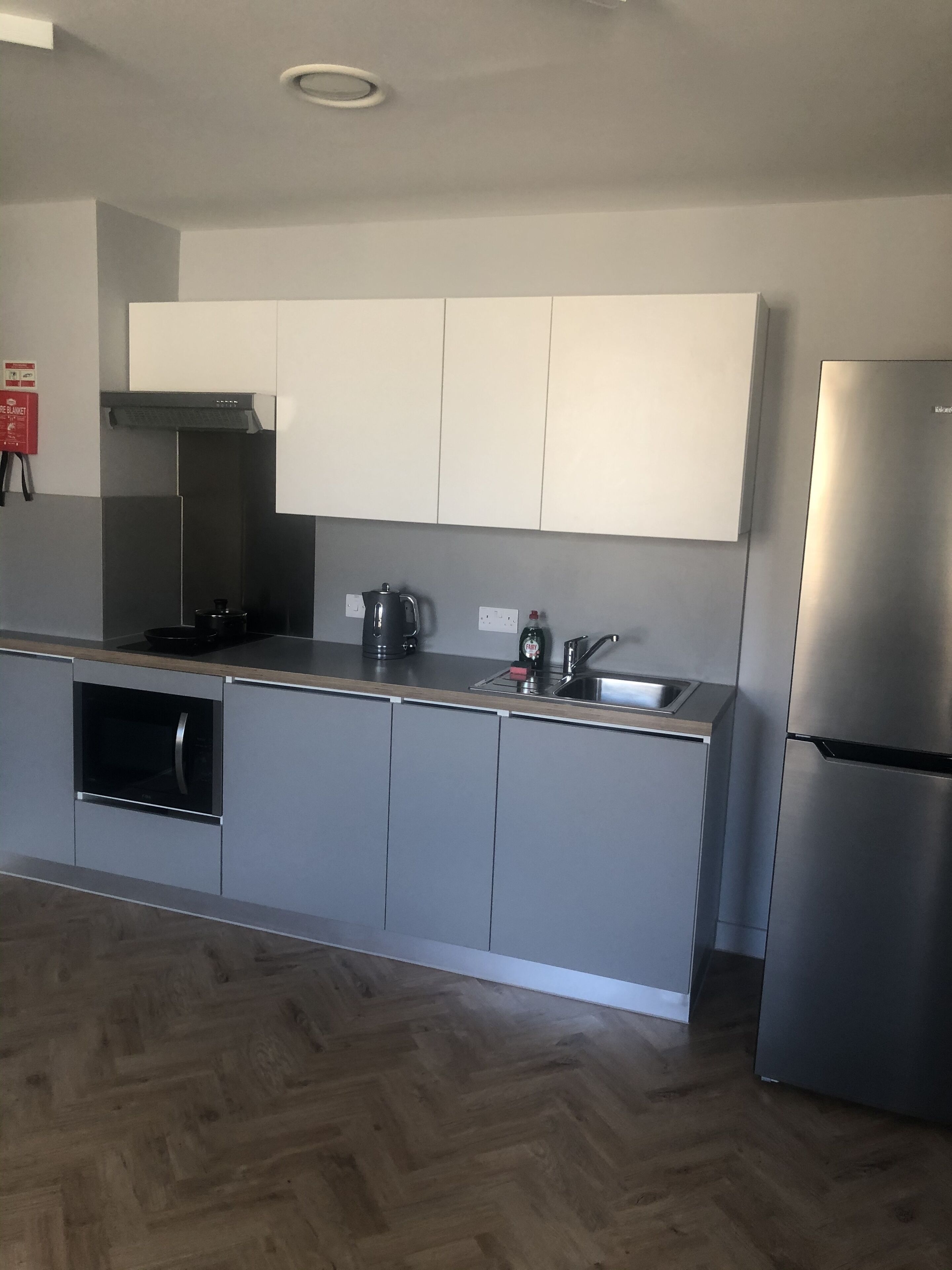 fridge, microwave, cleaning supplies