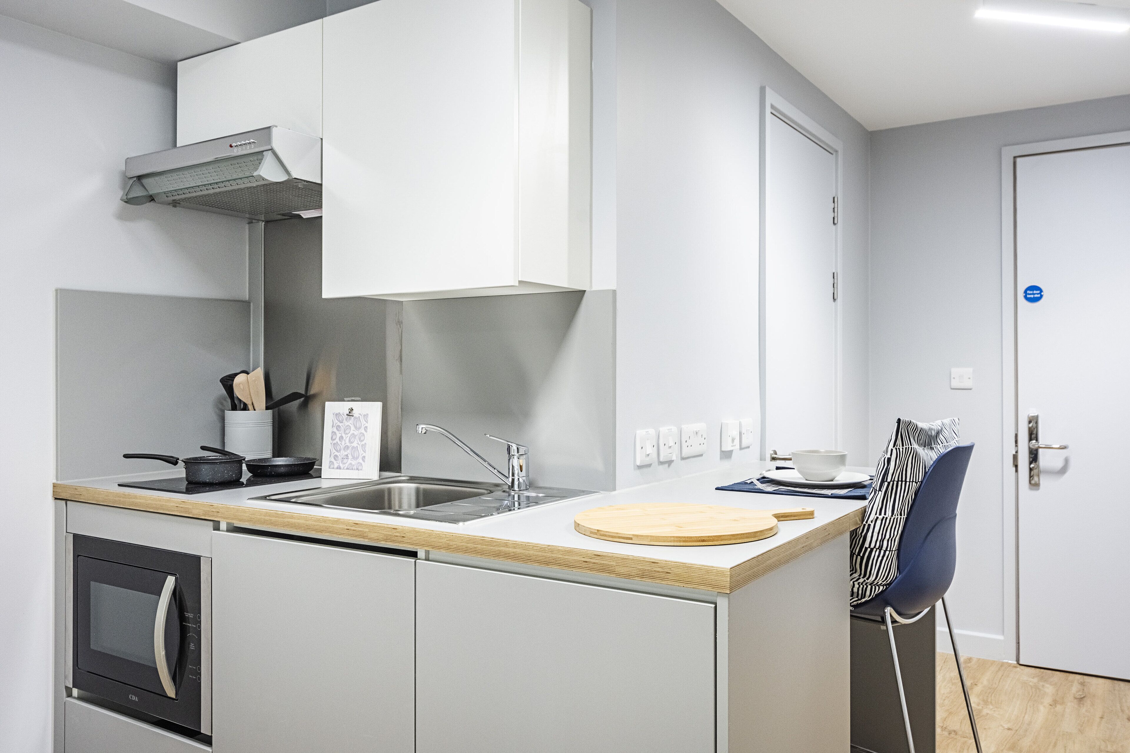 fridge, microwave, cleaning supplies