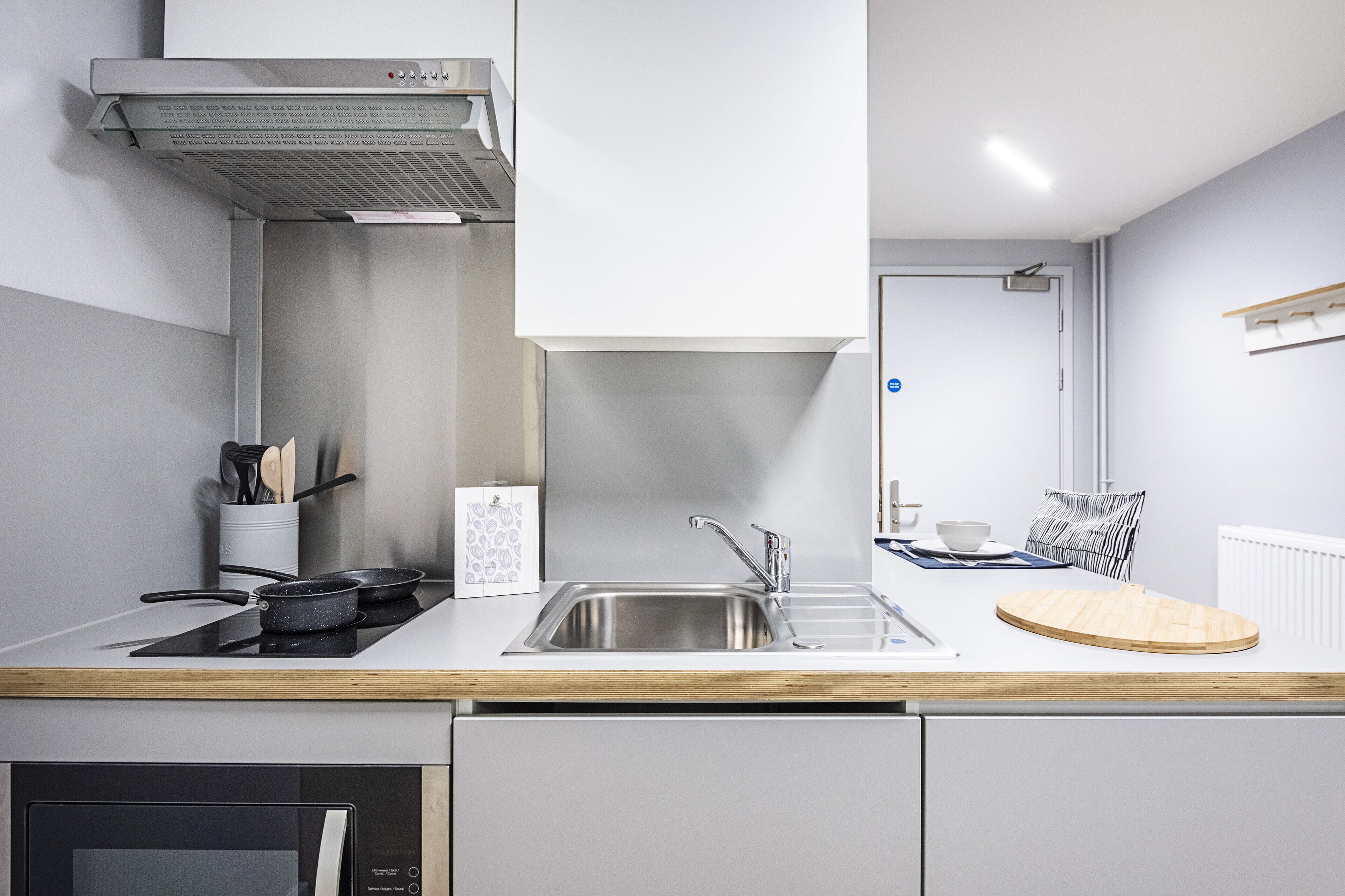 fridge, microwave, cleaning supplies