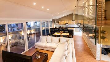 Penthouse | Living area | 50-inch Smart TV with satellite channels, TV