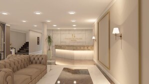 Un hall d’hôtel moderne avec un comptoir d’accueil, un canapé confortable et une plante en pot.