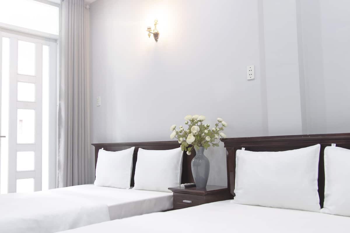 Economy Quadruple Room | Minibar, desk, blackout drapes, iron/ironing board