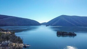 A calm lake with a small island in the center, surrounded by hills. - Best Dam View at Smith Mountain Lake!!! (Huddleston)