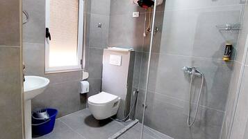 Family Apartment, 1 Bedroom, Non Smoking, City View | Bathroom | Shower, hair dryer, slippers, towels