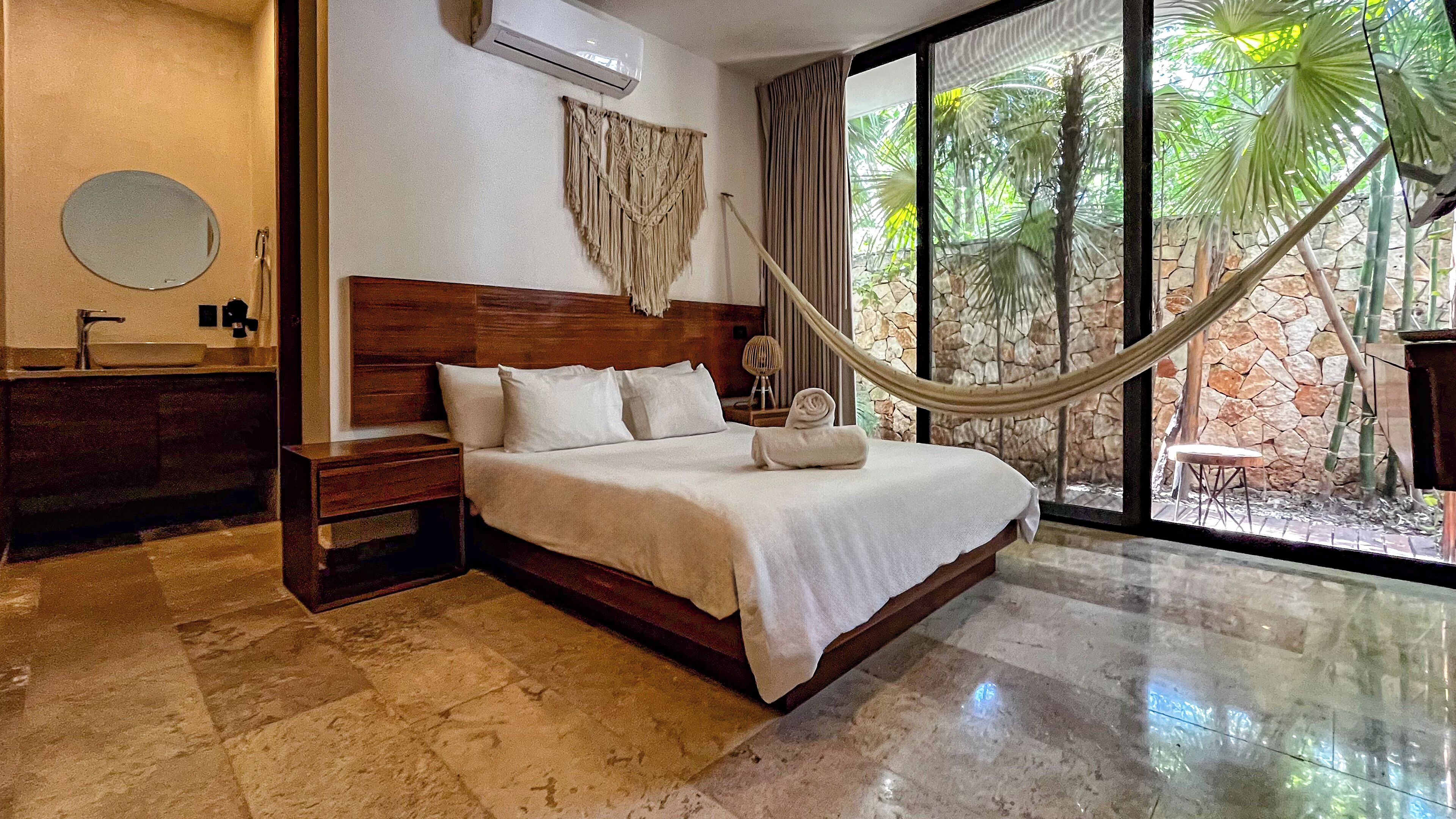 luxury room (deck garden view) | 3 bedrooms, in-room safe, iron/ironing board, bed sheets