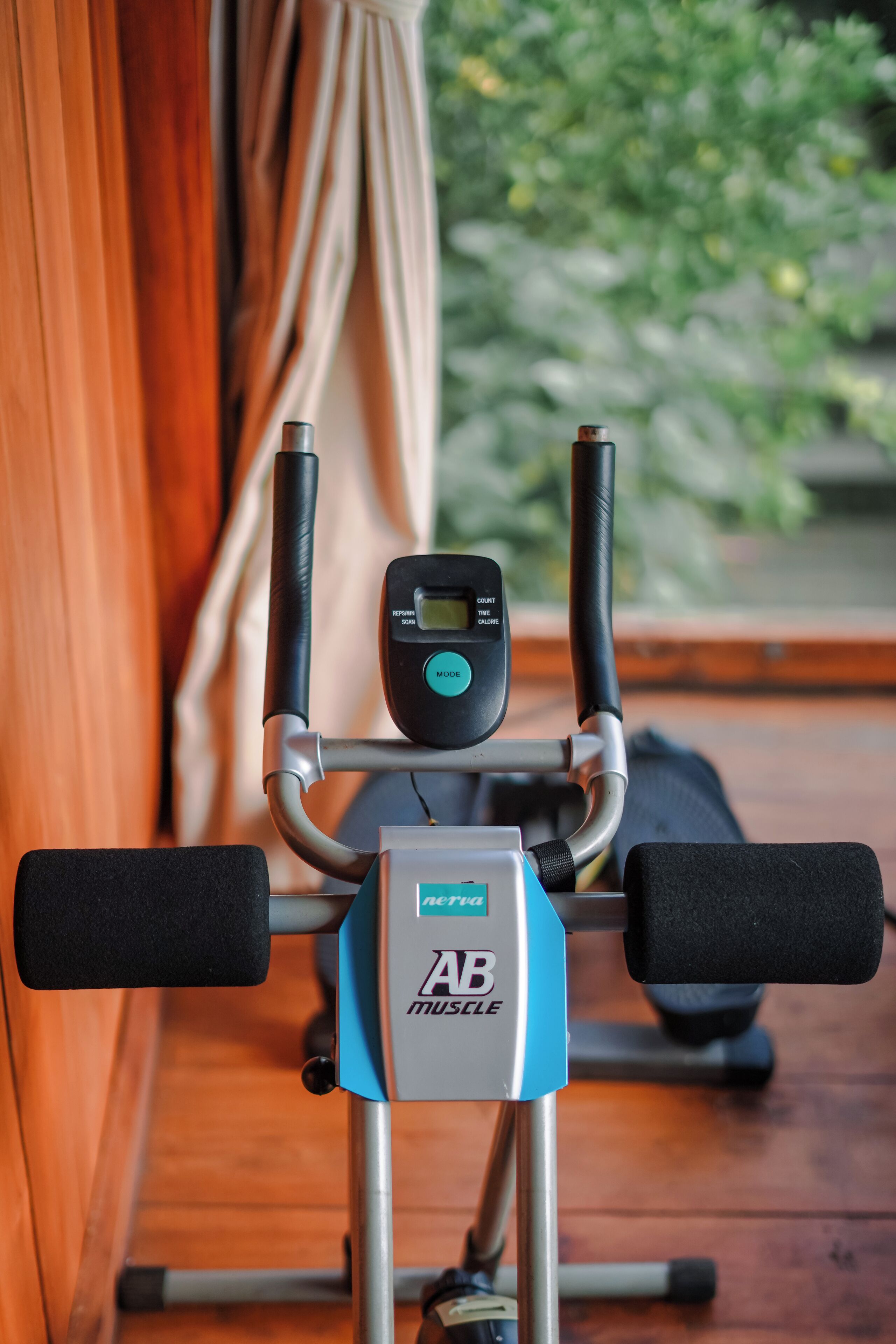 An exercise machine with a digital display and control buttons.