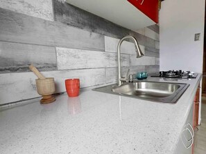 Fridge, microwave, stovetop, coffee/tea maker