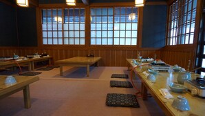 A traditional Japanese-style room with tatami mats, low tables, and shoji screens. - Tokiwatei (Hakuba)