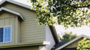 A two-story house with a garage, a front porch, and a small front yard. - Cozy home near Sun Valley Resort! (Bellevue)