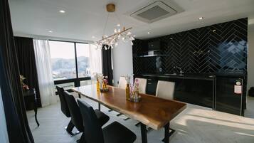 Luxury Suite (Condominium) | Living area | Flat-screen TV, computer