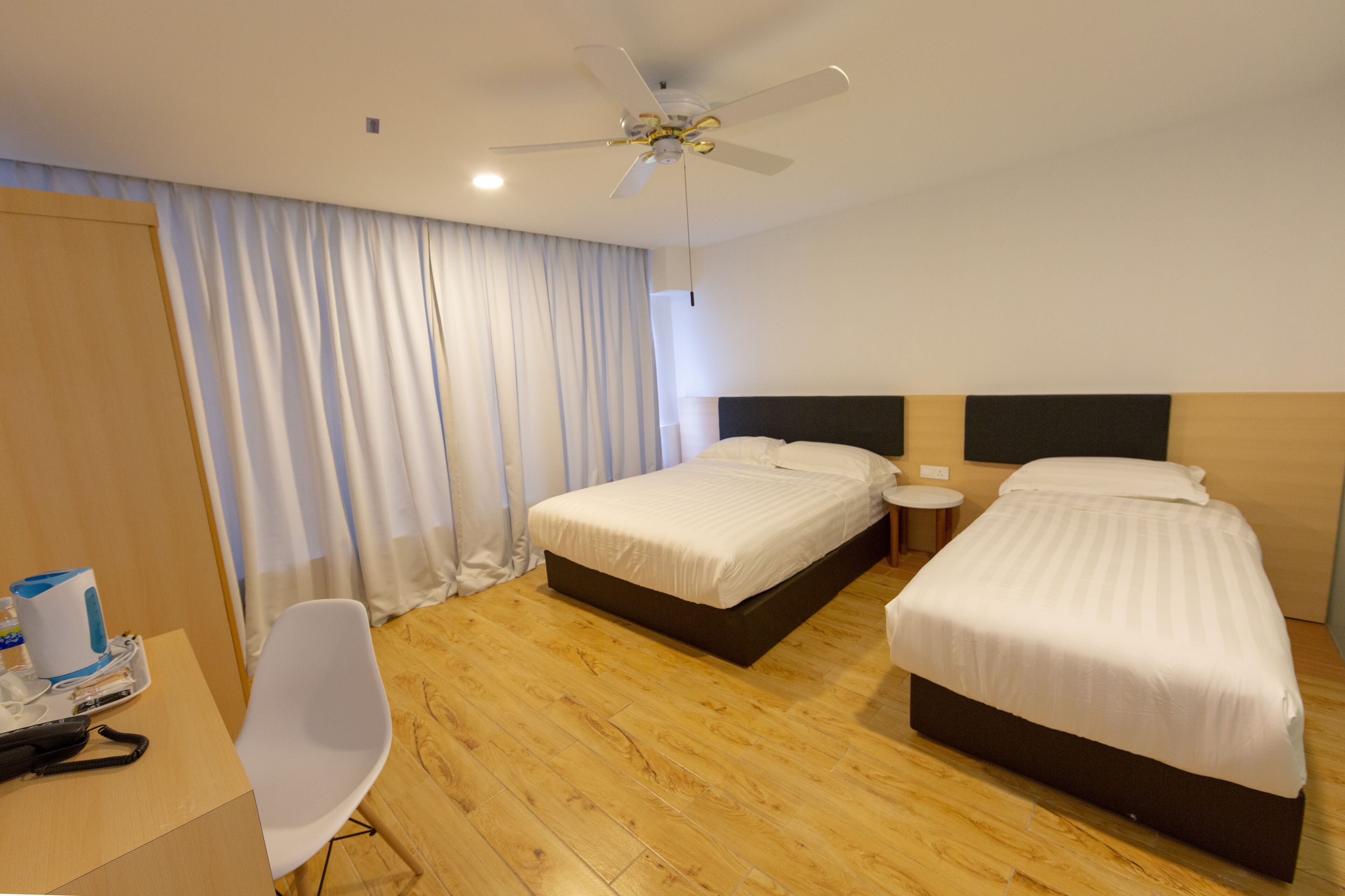 Deluxe Family Queen Room | Desk, blackout drapes, iron/ironing board, free WiFi