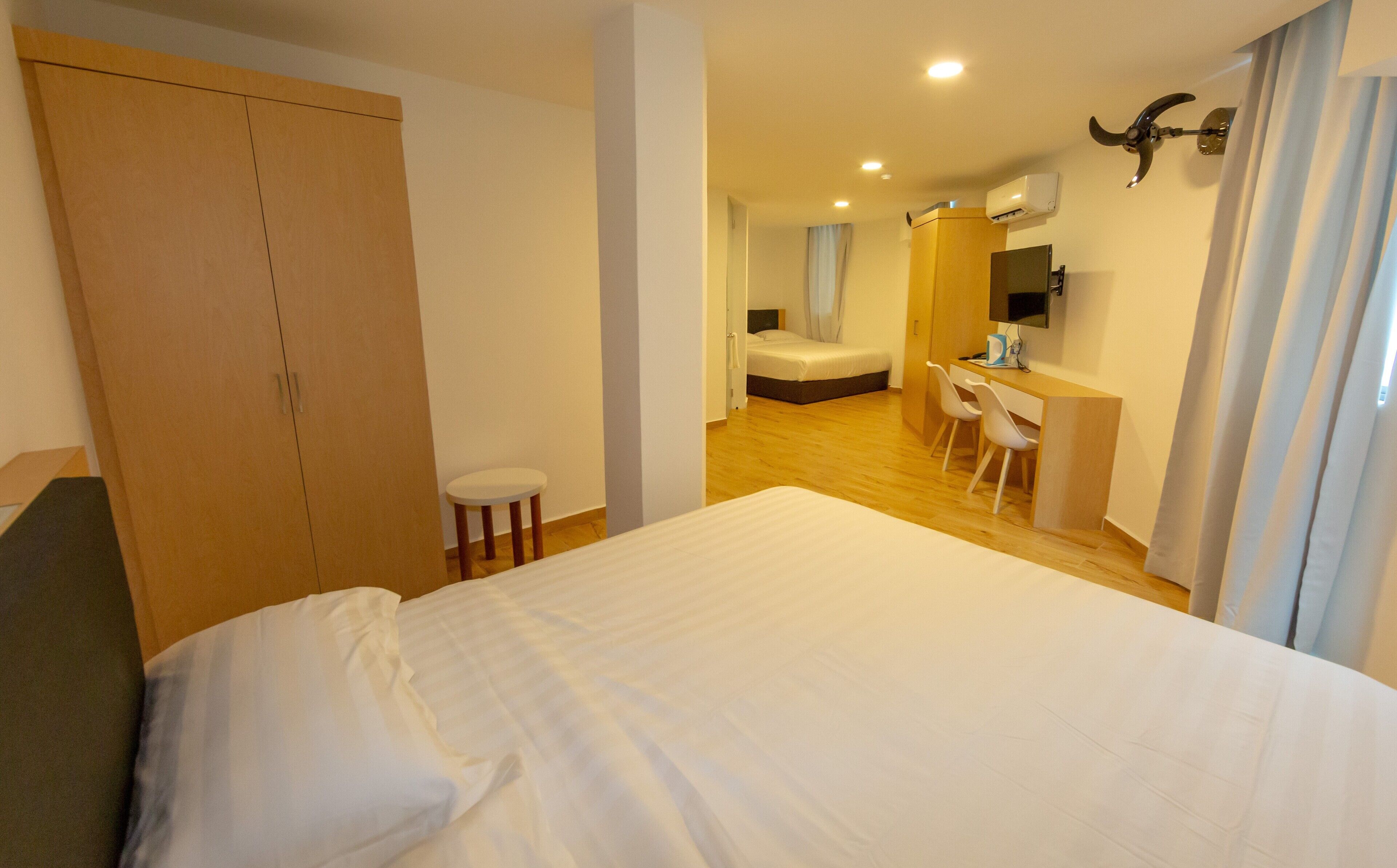 King Suite Room | Desk, blackout curtains, iron/ironing board, free WiFi