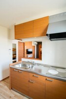 Fridge, microwave, electric kettle, cookware/dishes/utensils