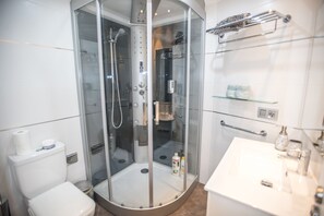 Luxury Studio, Ocean View | Bathroom | Shower, hydromassage showerhead, free toiletries, hair dryer