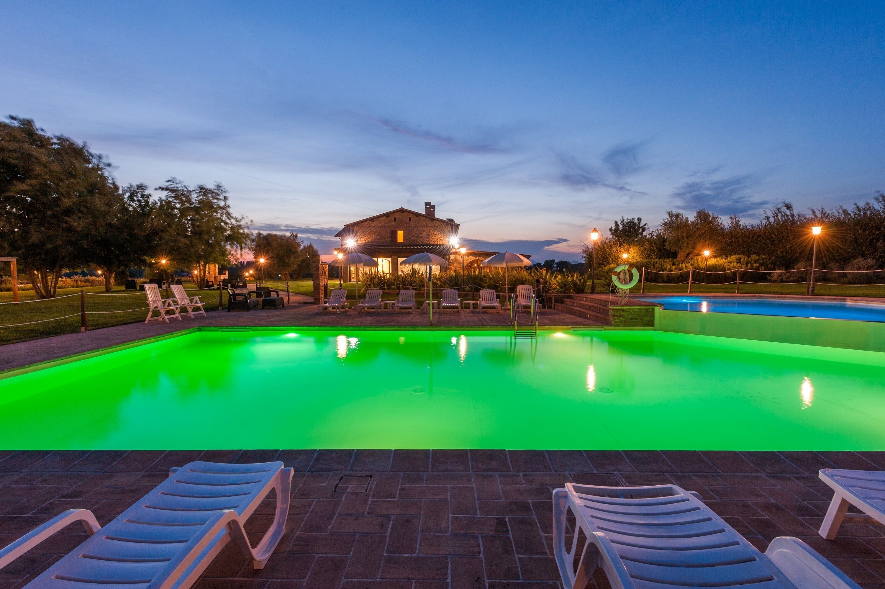 Seasonal outdoor pool, open 8:00 AM to 7:00 PM, pool umbrellas